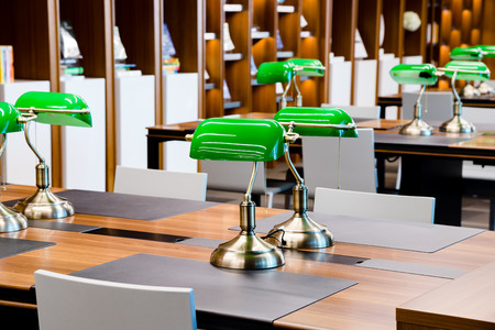 Green Lamps on table in libraryのeditorial素材