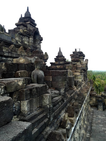 Ancient Buddha statue at Borobudur temple in Yogyakarta, Java, Indonesia.の写真素材