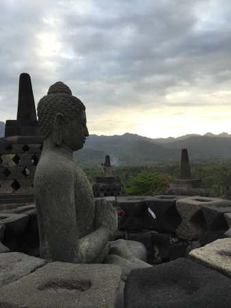 relief carving of borobudor pyramid on the walls of borobudur ruins near yogyakarta in java indonesiaの写真素材