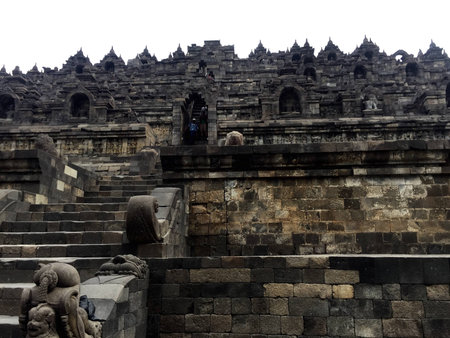 relief carving of borobudor pyramid on the walls of borobudur ruins near yogyakarta in java indonesiaの写真素材