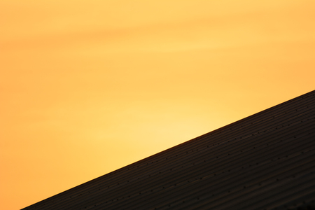 roof and sky on sunsetの写真素材