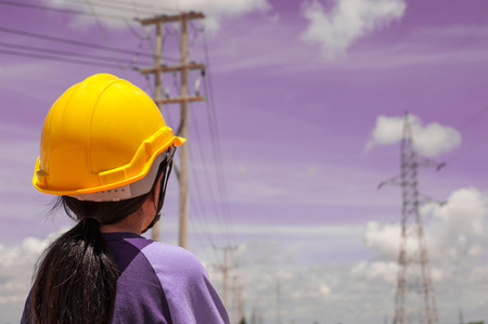 children engineer standing at electricity station ,Her dream was to become an engineerの写真素材