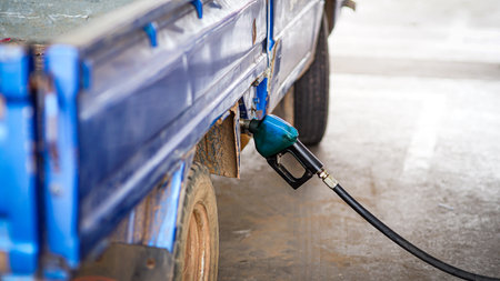 Car and scooter fueling at the gas station,oil power for energy old carの写真素材