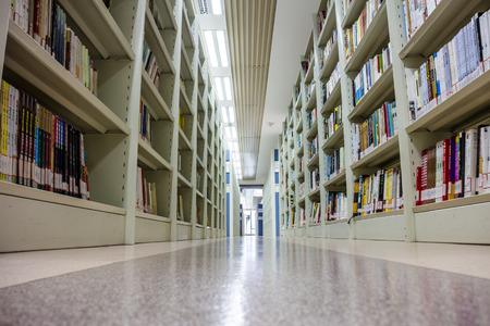 The bookshelves in the libraryのeditorial素材