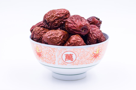 A bowl of red dateの写真素材