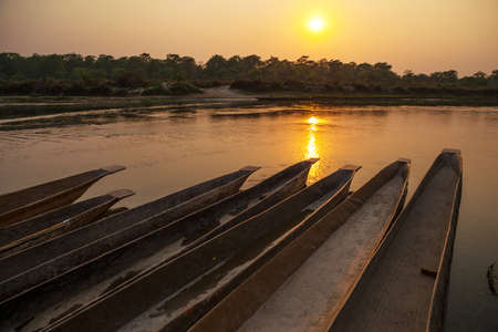 A canoe under the setting sunの写真素材