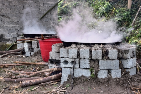 Outdoor kitchen - the big woks with small clouds of smoke above it.の写真素材
