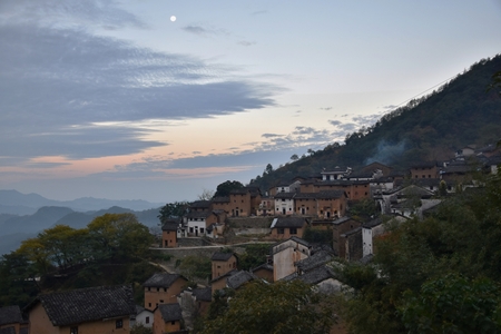 Sunrise in the Yangchan tulou, the chinese rural earthen dwelling in Anhui province in China.の写真素材