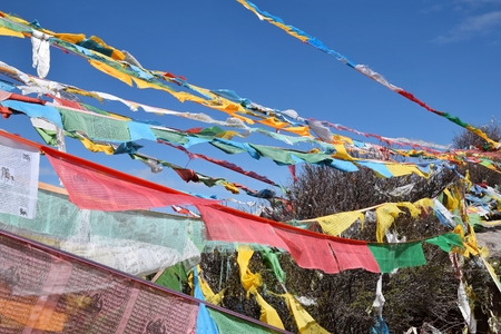 Tibetan prayer flags, colorful rectangular clothes, use to bless the surrounding countryside,...