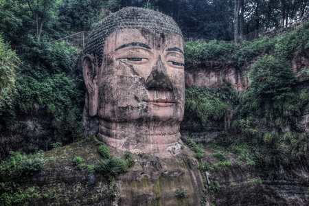 The detail of Leshan Giant Buddha 71 meters tall stone statue carved out of the cliff, faces confluence of Min River and Dadu River.の写真素材