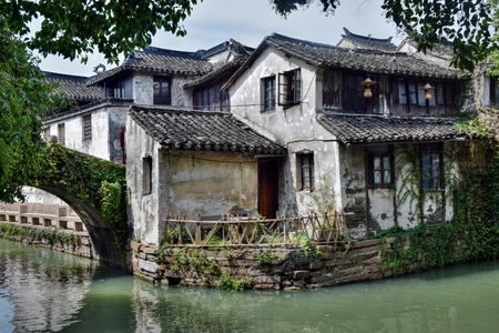 Venice of the East - Zhouzhuang water town. An old house in the bank of the stream in the Zhouzhuang water town in Jiangsu province in China.のeditorial素材
