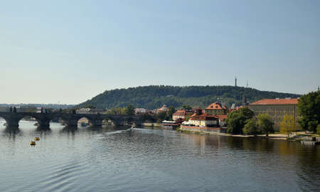 Prague, the capital city of the Czech Republic, cityscape with the famous Charles Bridge and the PetÅÃ­n Lookout Tower in the background.の写真素材