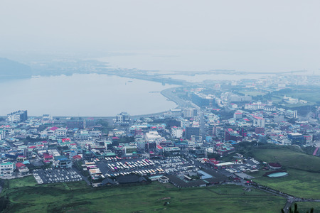 Landscape view of the city at the foot of the mountainのeditorial素材