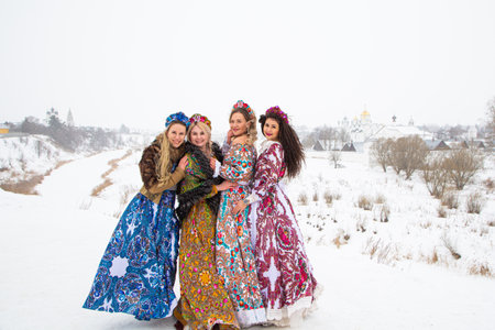 Russian girl in Russian national costumesof winter in a villageの写真素材