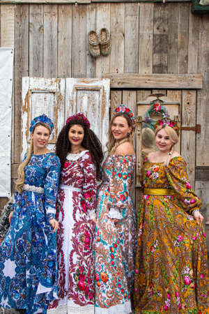 Russian girl in Russian national costumesof winter in a village