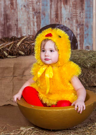 Cute girl play with real rabbit and duckling