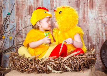 Cute girls play with real rabbit and duckling