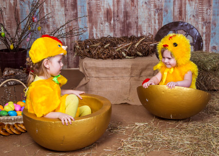 Cute girls play with real rabbit and duckling