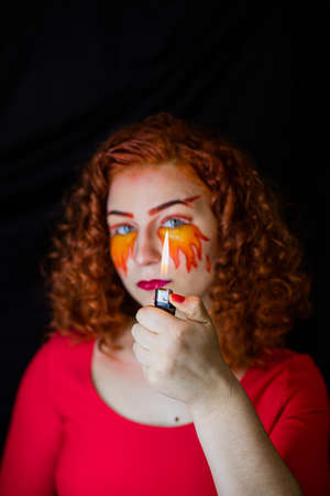 Portrait of a girl with a fiery make-up
