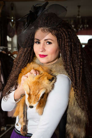 Portrait of a beautiful Russian girl in a kokoshnik and traditional dressの写真素材