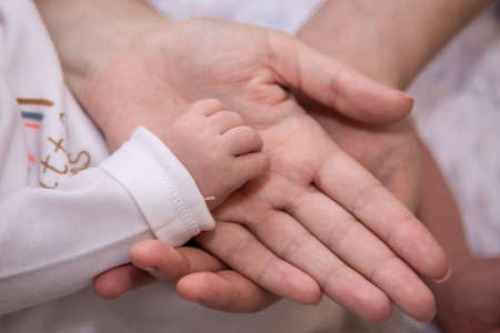 Handles and legs of the newborn babyの写真素材