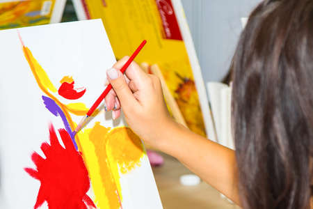 A group of Young individuals enjoying paint n sip activities outdoorの写真素材