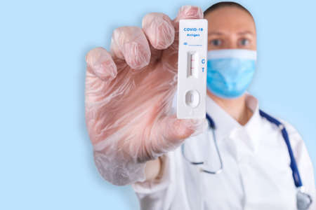 Doctor or medtech shows rapid laboratory COVID-19 test