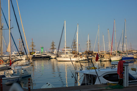 Wood platform beside yachts at marina .
