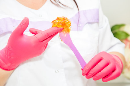 Hot wax waxing in the bowl for hair removal depilation epilation procedureの写真素材