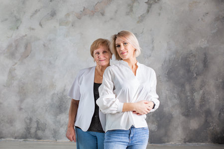 Portrait of elderly woman with her granddaughterの写真素材