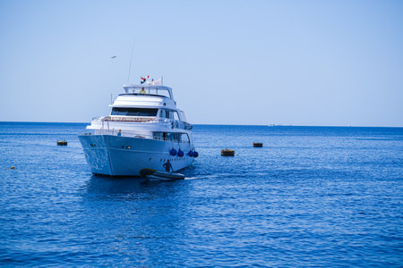 Sailing lboat at open sea in sunshine