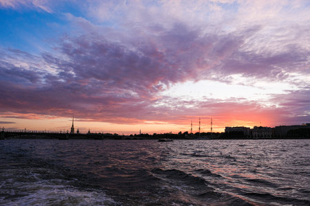 Sunset in St. Petersburg view from the river to the silhouette of the cityの写真素材