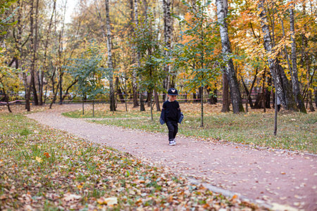 Cute children playing and laughing on autumn walkの写真素材