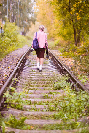 beauty pregnancy girl walking on the railwayの写真素材