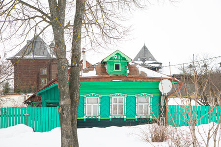 A Russian wood house covered in snowの写真素材