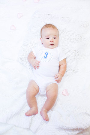 Adorable little baby portrait. 3 month child smiling.