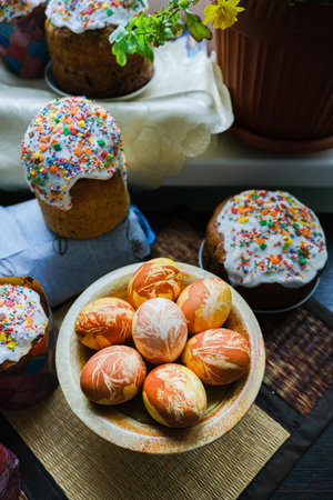 Close-up view of chicken eggs, homemade easter cake and willow twigs