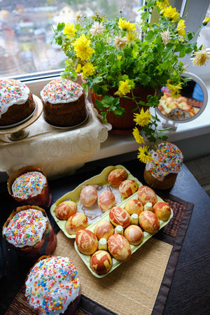 Close-up view of chicken eggs, homemade easter cake and willow twigs