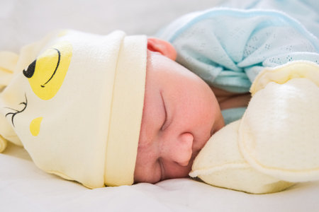 Newborn Baby Sleeping In Hospital Bassinet with momの写真素材