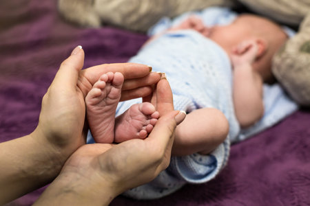 Handles and legs of the newborn babyの写真素材