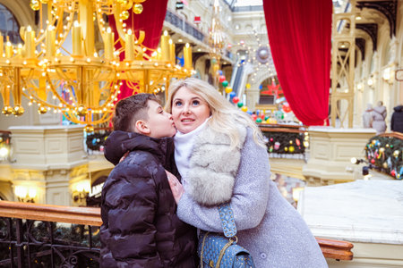 mom and son take a walk on christmas holidaysの写真素材
