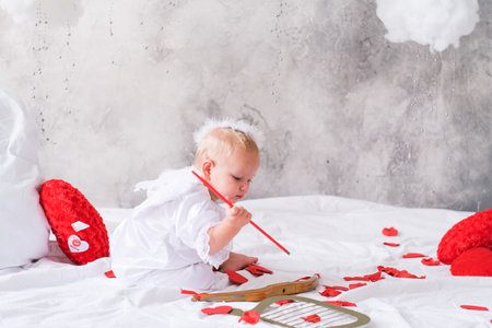 little baby with angel wings, valentines day conceptの写真素材