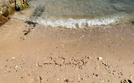 Year 2025 Written in Sand. Christmas