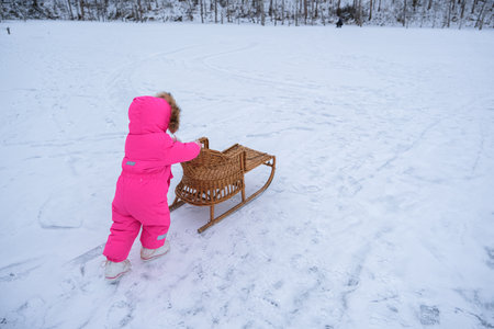 A child carries a tube up the hill. High quality photo