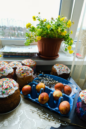 Close-up view of chicken eggs, homemade easter cake and willow twigs. High quality photo