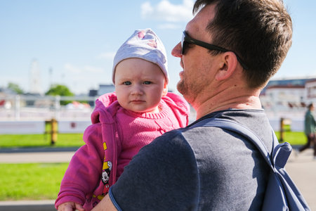 Dad and daughter walk around the city. High quality photo