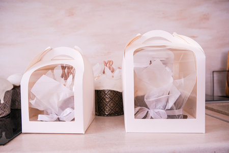 Moscow, Russia, 04/18/25. Two white boxes with a white paper inside. The boxes are placed on a...
