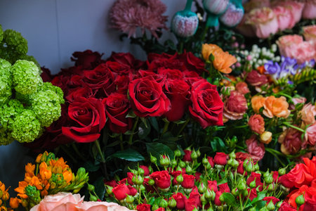 A bouquet of flowers with a mix of red and green flowersの写真素材