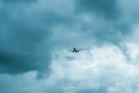Moscow, Russia, 08/18/2025 Commercial airplane flying against cloudy sky. Aircraft in air. Travel, vacation, and aviation concept. Global transportation.の写真素材