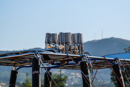 pamukkale, Turkiye, 07/08/2025 Close up of hot air balloon burner system against a clear blue sky, showing adventure and travel concept.の写真素材